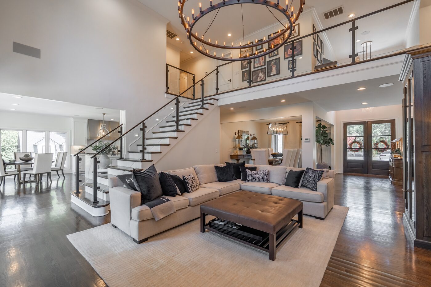 Two-story living room with a Restoration Hardware chandelier